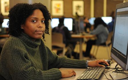 girl in front of computer, facing the camera.